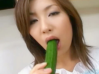 Japanese milf Saku ona gets horny with vegetables