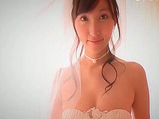 Japanese sweetheart fingers her pussy in nippon panties while images of XXX porn flickers on screen